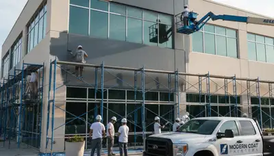 Professional commercial painters refinishing Milwaukee WI office building exterior with durable coatings