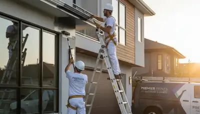 Professional gutter painting on Milwaukee WI home exterior by expert house painters