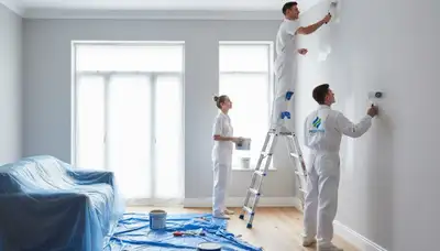 Professional interior painters finishing living room walls in Milwaukee, WI home