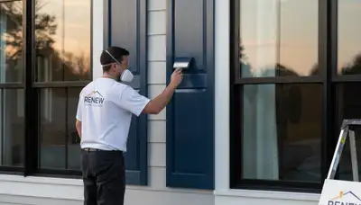 Professional shutter painting on a Milwaukee WI home exterior by expert house painters